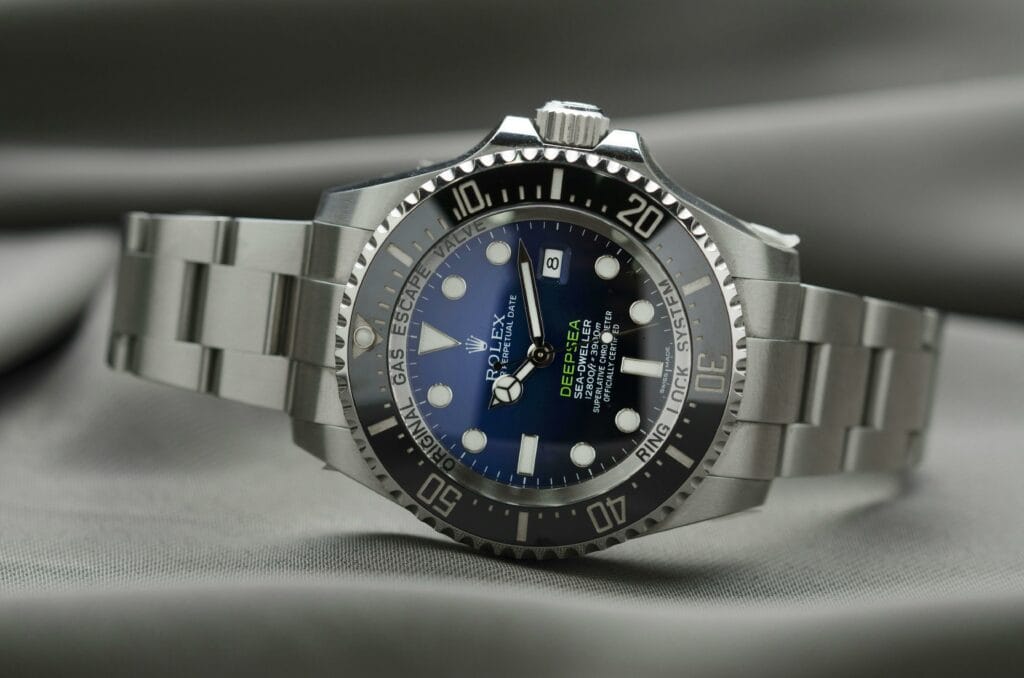 A luxury Rolex watch laying on its side